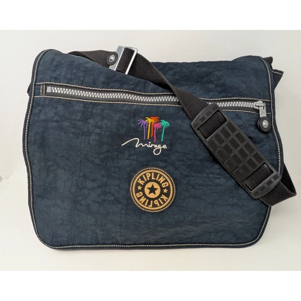 Kipling Madhouse Postman Bag Mirage Las Vegas Logo Expandable Messenger Bag Blue